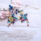 Boucles d'oreilles grandes créoles Fleurs de Tiaré en tissu liberty dreams of summer multicolore