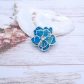 Broche fleur de cerisier en TISSU art déco bleu