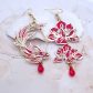Boucles d'oreilles asymétriques poisson et fleurs en Liberty Capel rouge