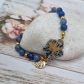 Bracelet élastique hibiscus en liberty Pepper blue et perles d'AVENTURINE bleues